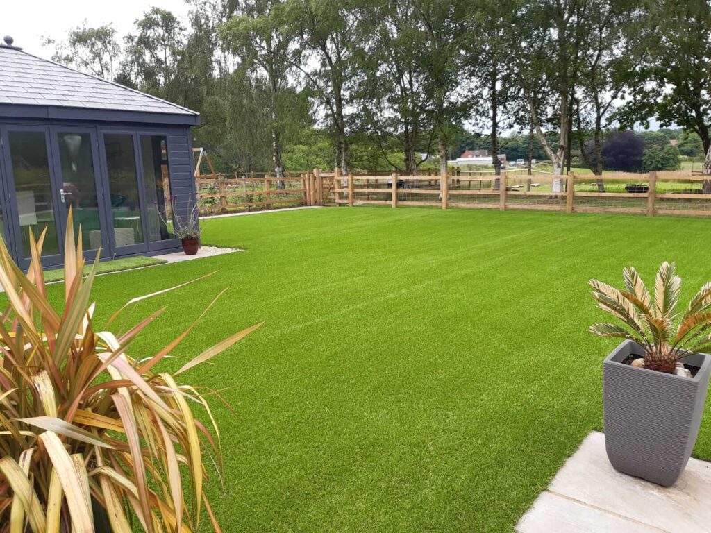 Photo of a large garden that had artificial grass to add value to their home. 