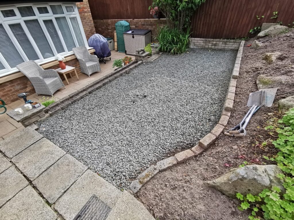 Small garden are covered in gravel.