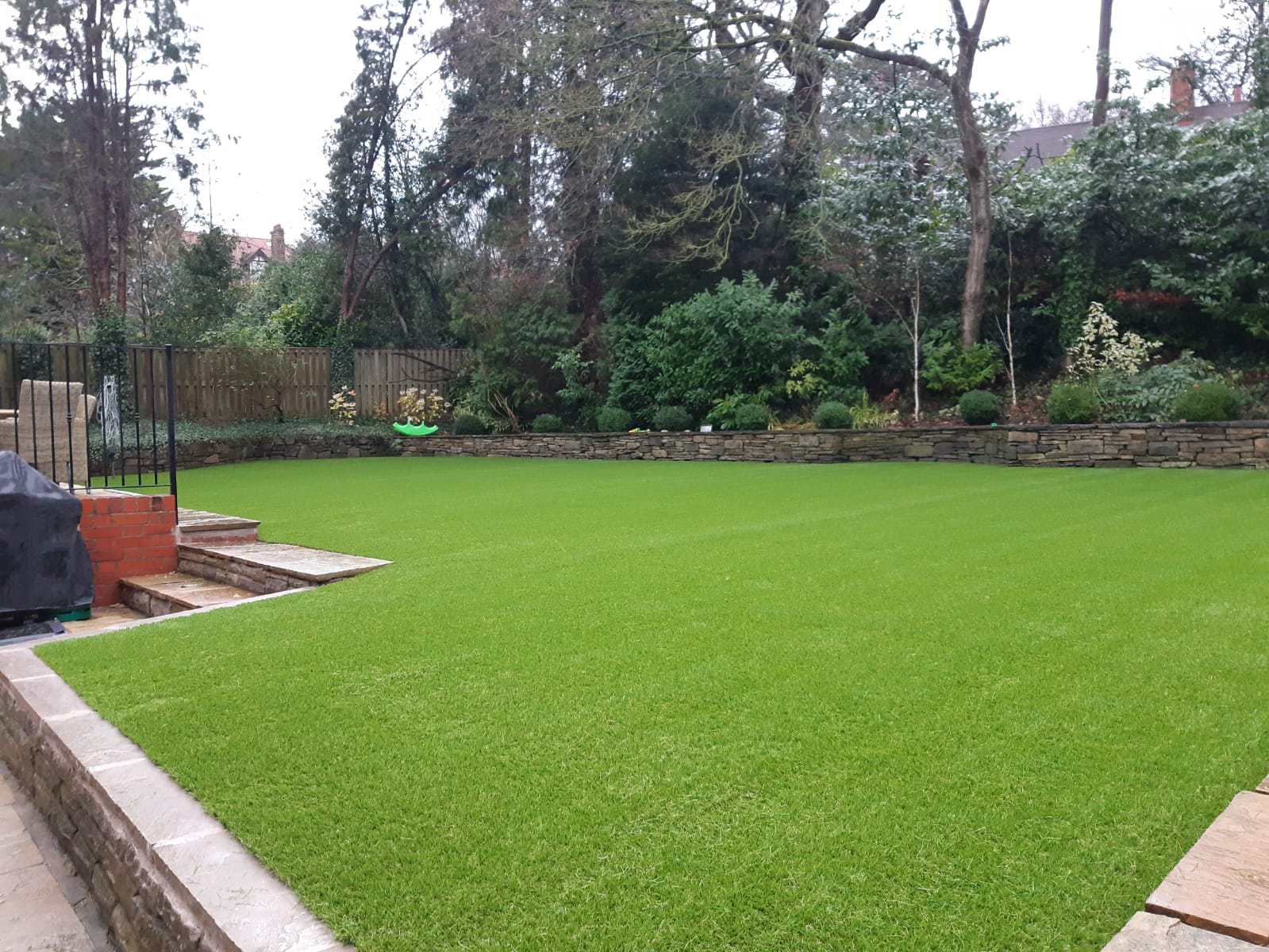 Big family garden installed with artificial grass.