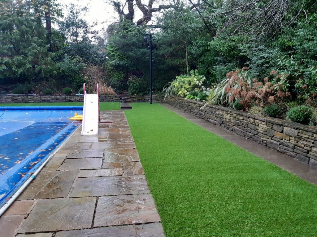 Artificial grass down round a pool install