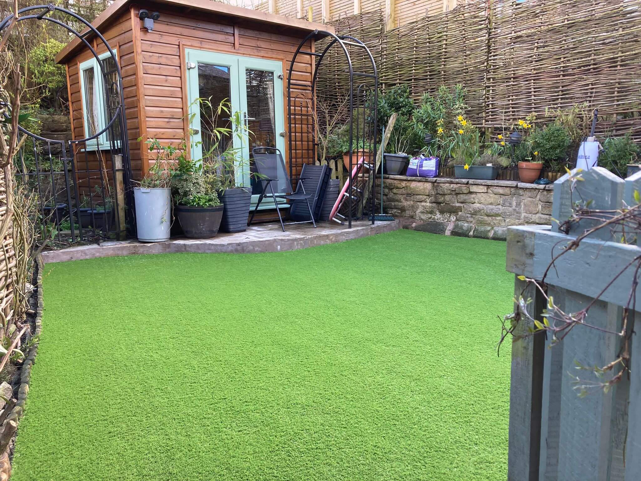 Photo of avonside dog boarding garden with new and clean artificial grass fitted.