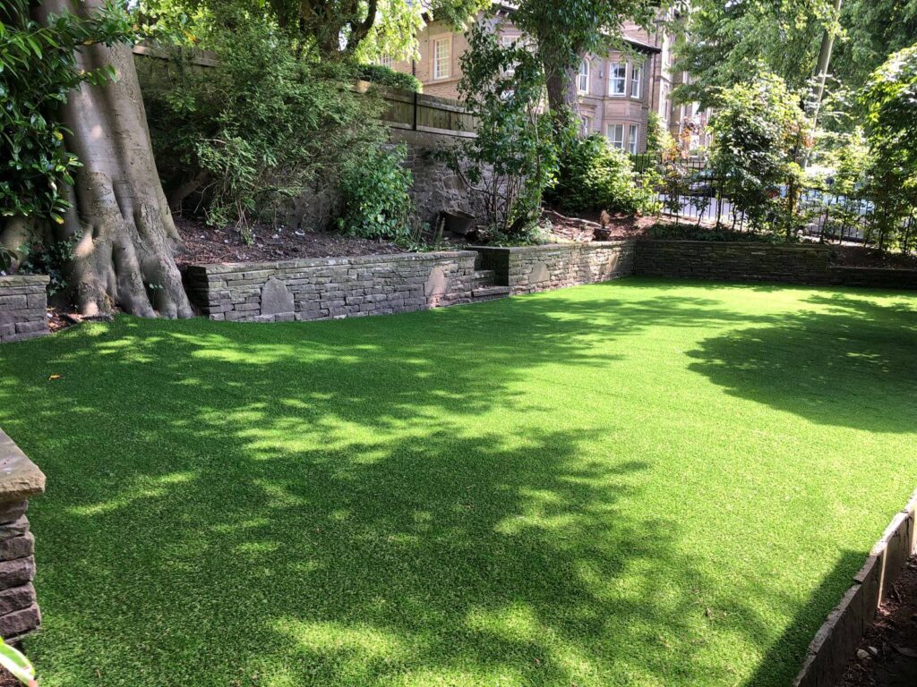 Photo of a garden with the best fake grass for dogs installed.