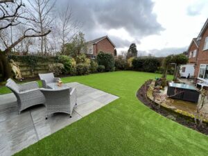 Wide angle patio and artificial grass garden